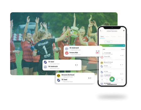 Handyscreen mit Spieltagsterminen, jubelnde Frauenmannschaft im Hintergrund